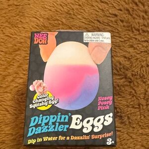 Nee Doh Dippin' Dazzler Eggs - Color Changing Squishy nosey posey pink